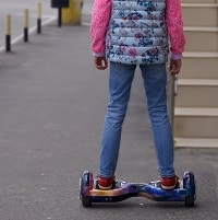 girl riding a hoverboard