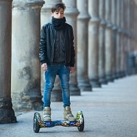 boy riding a hoverboard