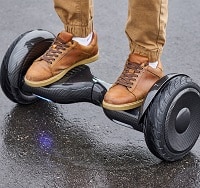 man using a black hoverboard