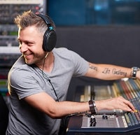 professional musician mixing with headphones