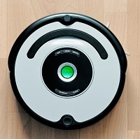Silver and black robot vacuum