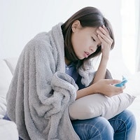 woman get sick and fever